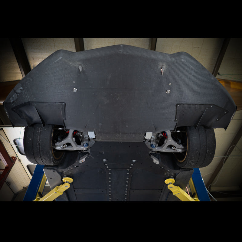 Underside view of the oversized Zebulon Splitter installed on a C8 Corvette