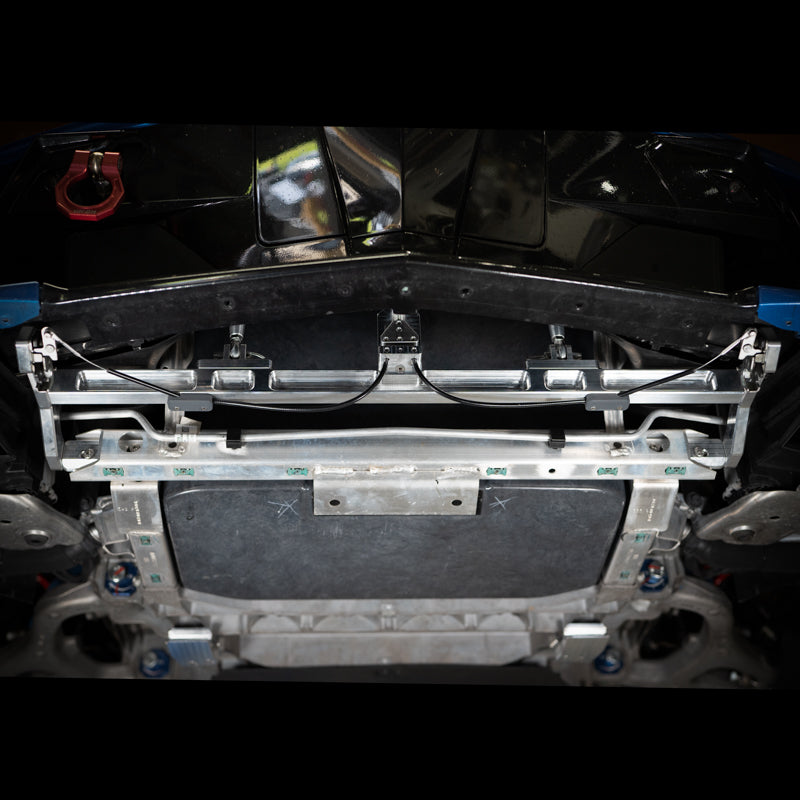 AMT Motorsport billet quick-release splitter structure installed on a C8 Corvette