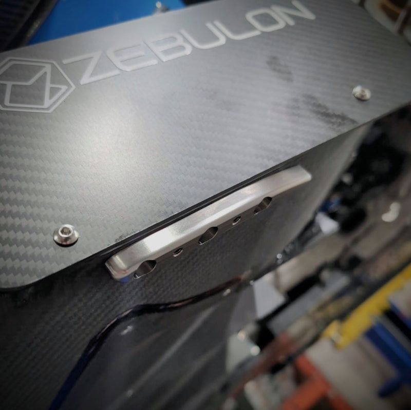 Carbon-fiber end plate and titanium skid block on the Zebulon Splitter